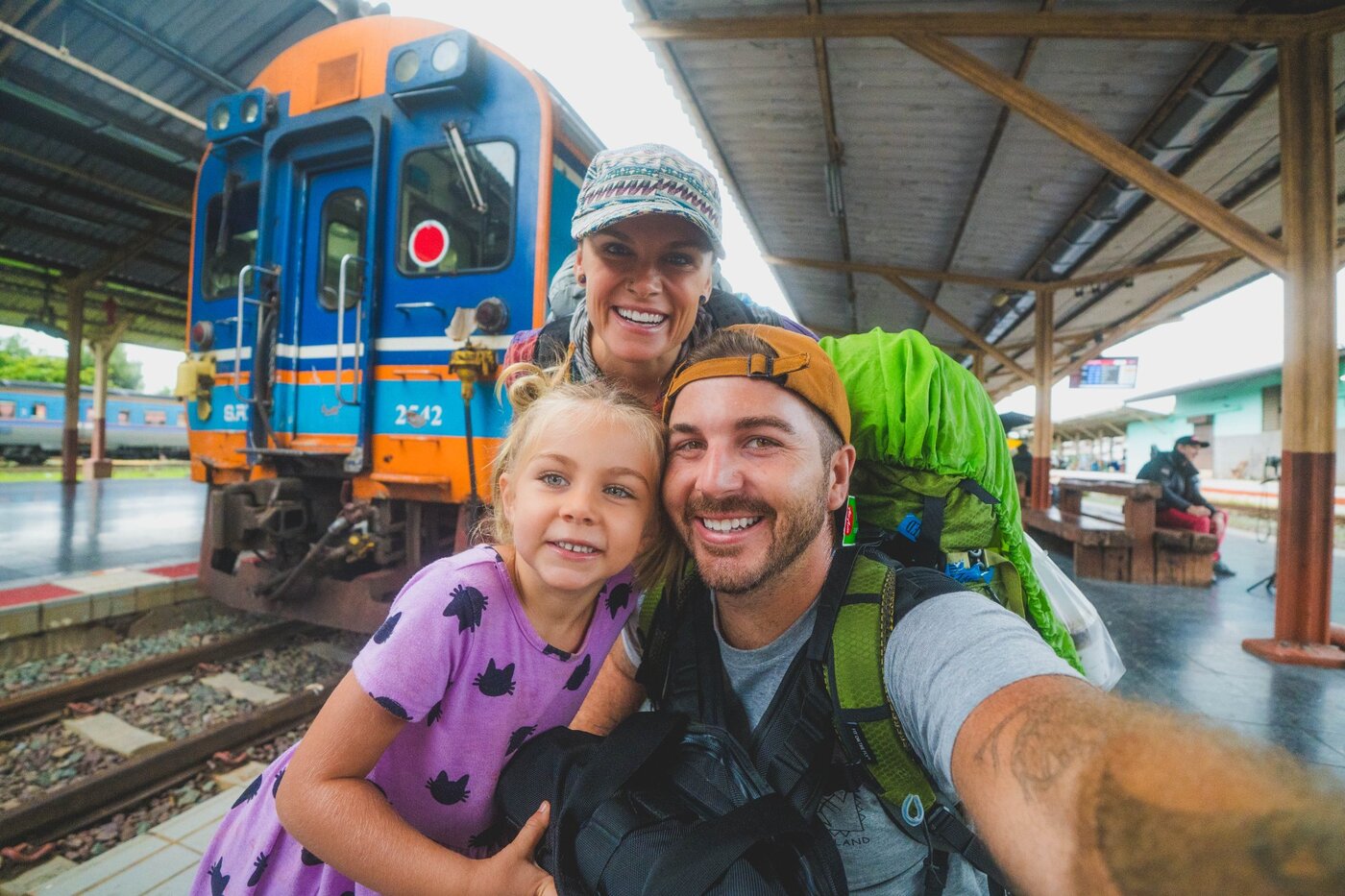 The Their Happy Trails family at a train station in Thailand