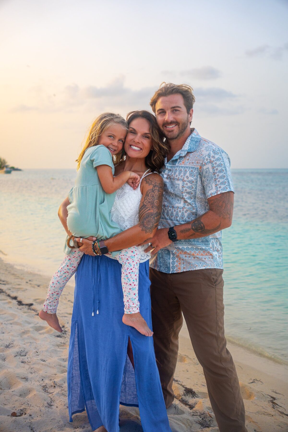 Matt, Erika and Shanti on a beach at golden hour